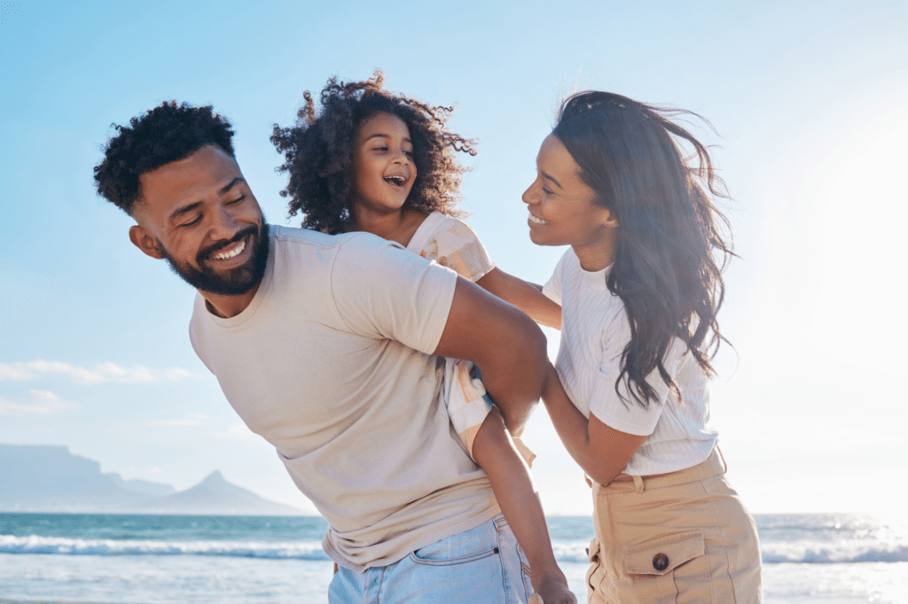Family playing together on a beach