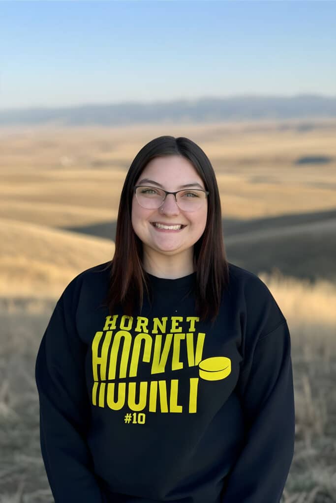 Emalea, EDDA, outdoors in a Hornet Hockey sweatshirt